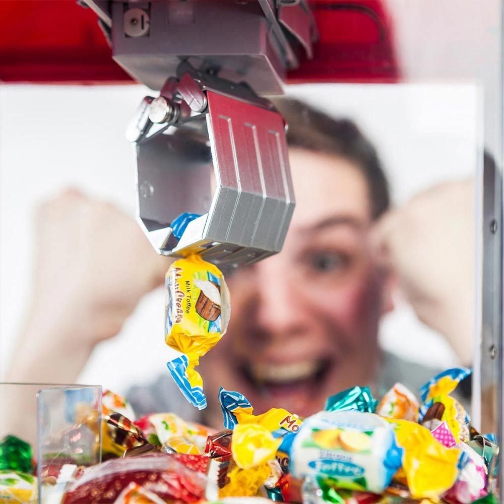Grab Candy vagy játékgép-adagoló édességek vagy cukorkák megragadásához
